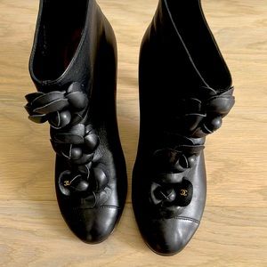 Chanel leather black booties with flower detail